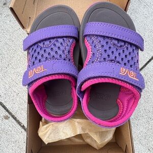 New in box. Teva Kids Purple and Pink Sandals Sz 5.